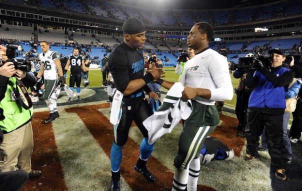 Panthers quarterback Cam Newton (left) and Jets quarterback Geno Smith exchange jerseys after the game. (PHOTO: David T. Foster, Charlotte Observer)